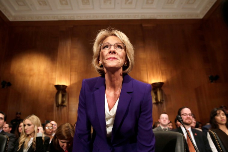 Image: Betsy DeVos arrives at the Senate Health, Education and Labor Committee confirmation hearing t