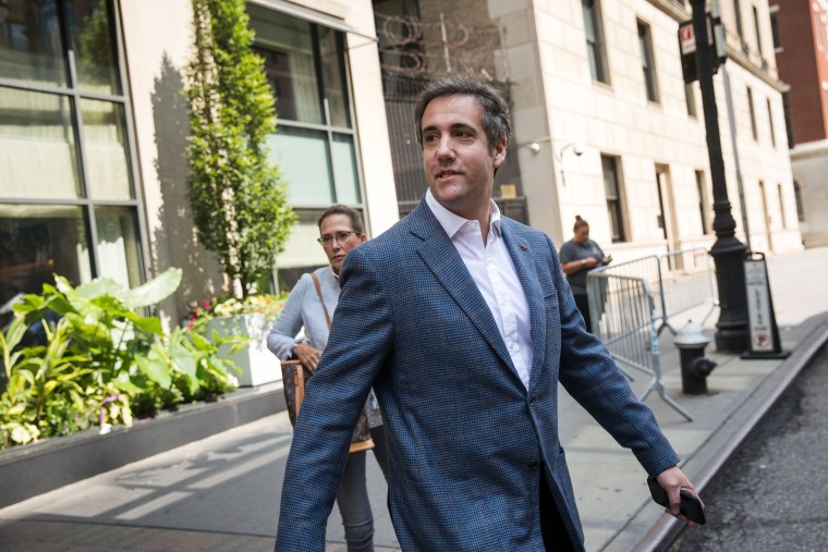 Image:  Michael Cohen leaves his hotel