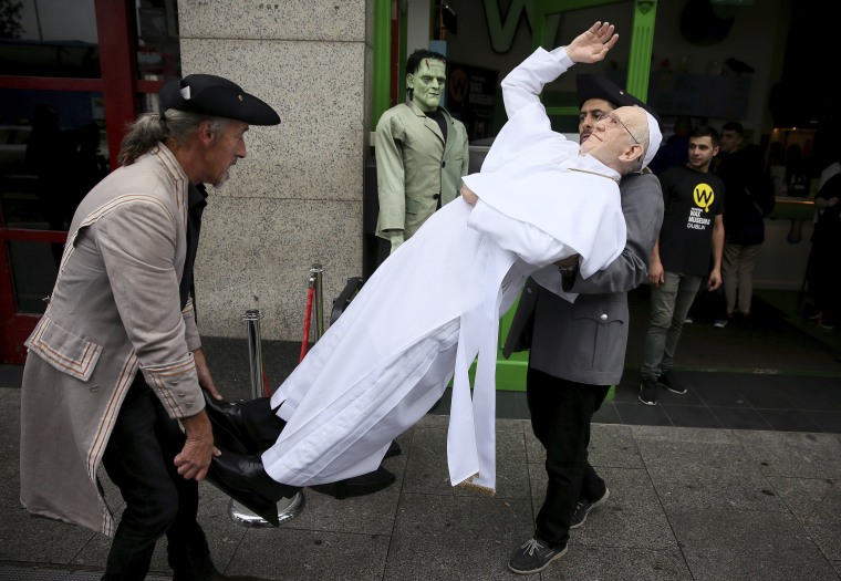 Image: A newly unveiled waxwork of Pope Francis is carried in Dublin