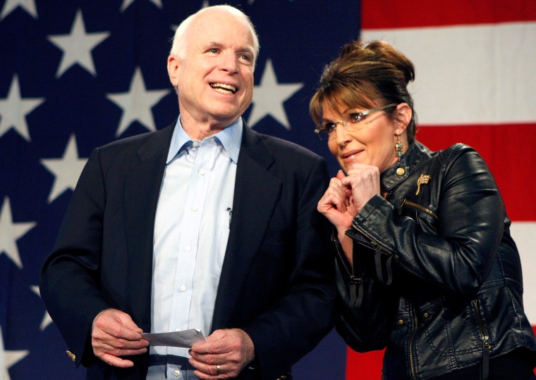 Image: FILE PHOTO -  U.S. Senator John McCain and former Alaska Governor and vice presidential candidate Palin acknowledge crowd during a campaign rally for McCain at the Pima County Fairgrounds in Tucson