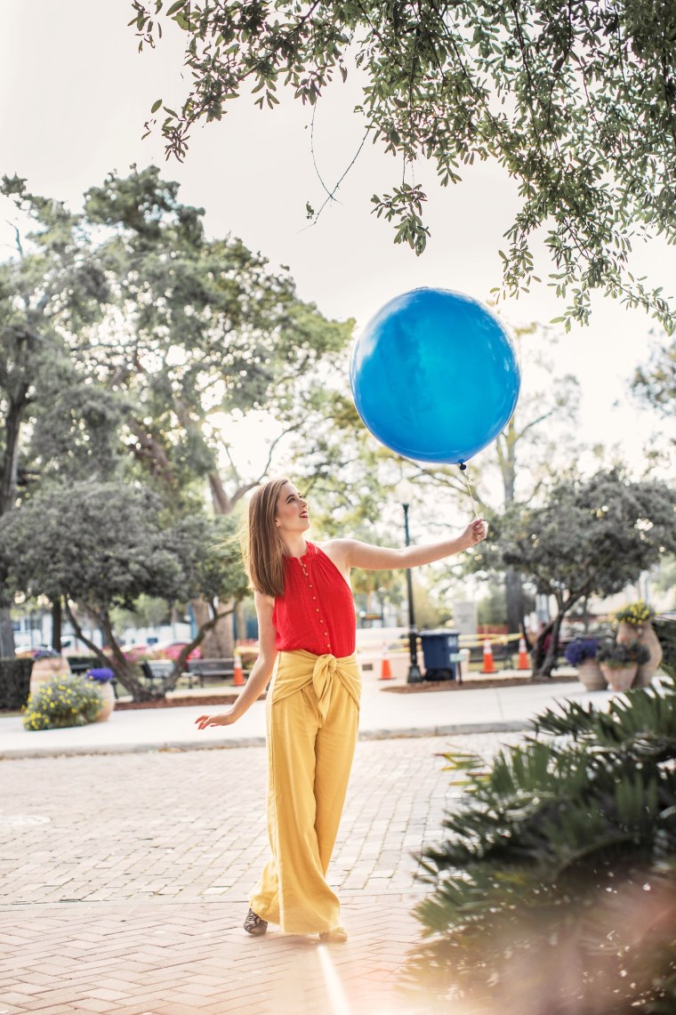 Chelsea Watson, who posts Disney-inspired outfits on her @styledbymagic Instagram account, DisneyBounding as Winnie the Pooh.