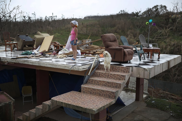 Image: Irma Maldanado stands in what is left of her home in Corozal, Puerto Rico