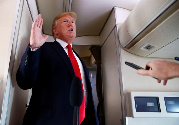 Image: President Donald Trump speaks to the press aboard Air Force One en route to Bedminster, New Jersey, from Joint Base Andrews
