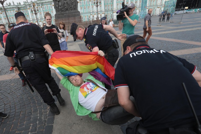 Image: A demonstrator is detained by police during the LGBT rally in central St. Petersburg