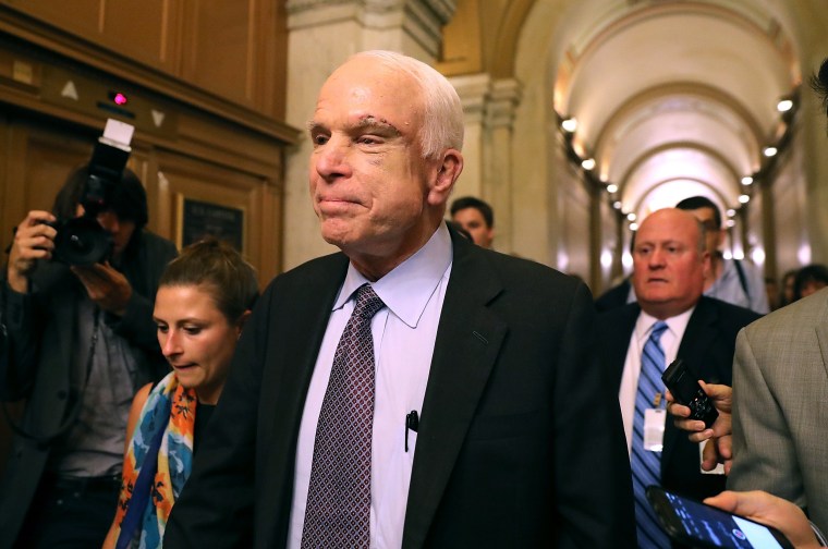 Image: Sen. John McCain leaves the the Senate chamber at the U.S. Capitol after voting on the GOP 'Skinny Repeal' health care bill