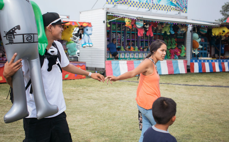 Image: Laurencia Starblanket spends an afternoon with her boyfriend and siblings at the state fair in Missoula