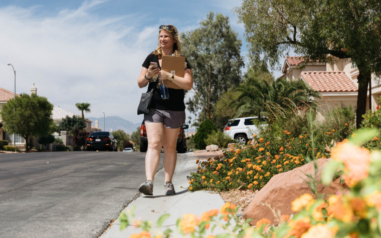 Image: Julie Pazina walks through a Las Vegas neighborhood canvassing
