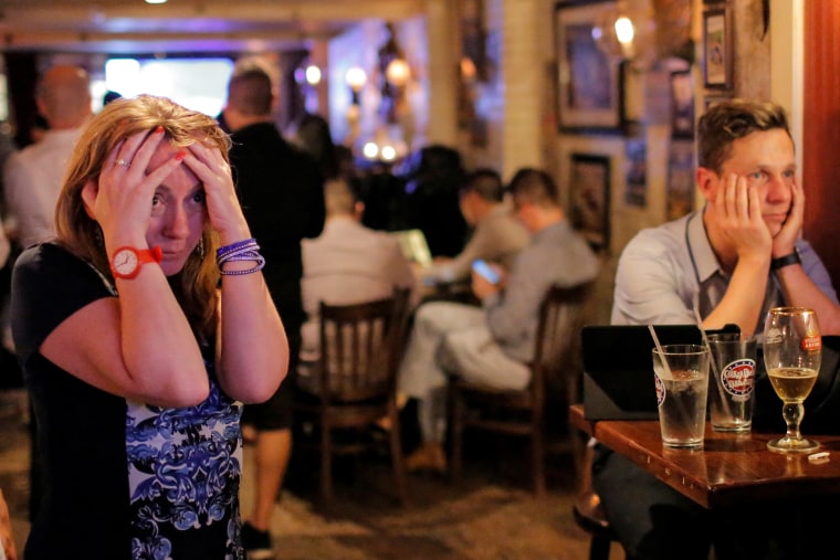 Image: People gathered in The Churchill Tavern, a British themed bar, react as the BBC predicts Britain will leave the European Union, in the Manhattan borough of New York