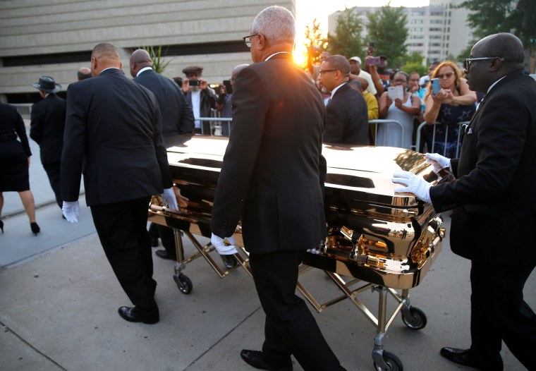Image: Aretha Franklin's casket is carried into the Charles H. Wright Museum of African American History in Detroit