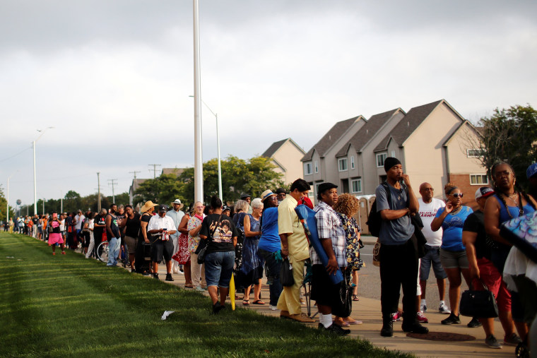 Image: People wait in line outside the Charles H. Wright Museum of African American History