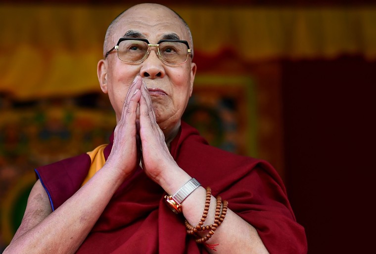 Image: The Dalai Lama taking to the stage to address the faithful in Aldershot