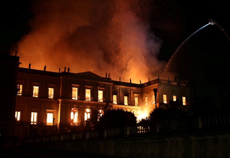 Image: Firefighters try to extinguish a fire at the National Museum of Brazil in Rio de Janeiro