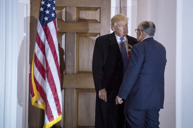 Image: Then-President-elect Donald Trump talks with Rudy Giuliani after a meeting at the clubhouse at Trump National Golf Club Bedminster in Bedminster Township, New Jersey on Nov. 20, 2016.