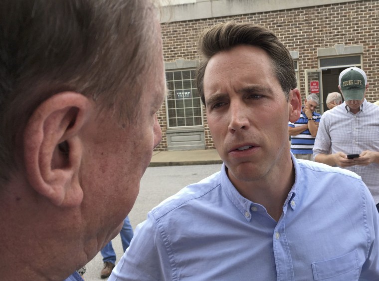 Image: Republican U.S. Senate candidate Josh Hawley speaks with a man during a campaign rally in suburban St. Louis