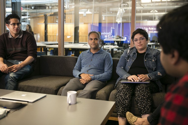 Image: Samidh Chakrabarti, product manager of Civic Engagement, center, during a meeting at Facebook headquarters' "situation room"