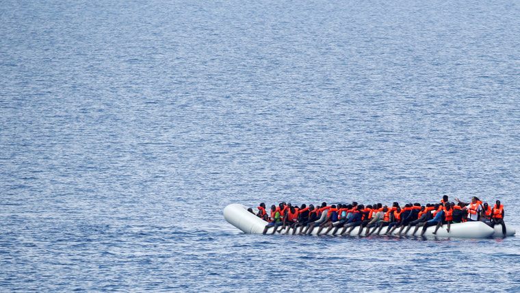 Migrants wait to be rescued in the Mediterranean Sea off the coast of Libya.