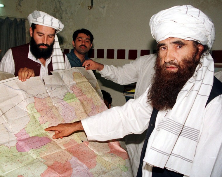 Image: Jalaluddin Haqqani points to a map of Afghanistan in October 2001