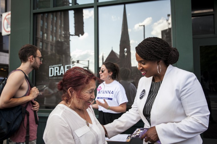 Image: Ayanna Pressley greets people on the streets in Cambridge