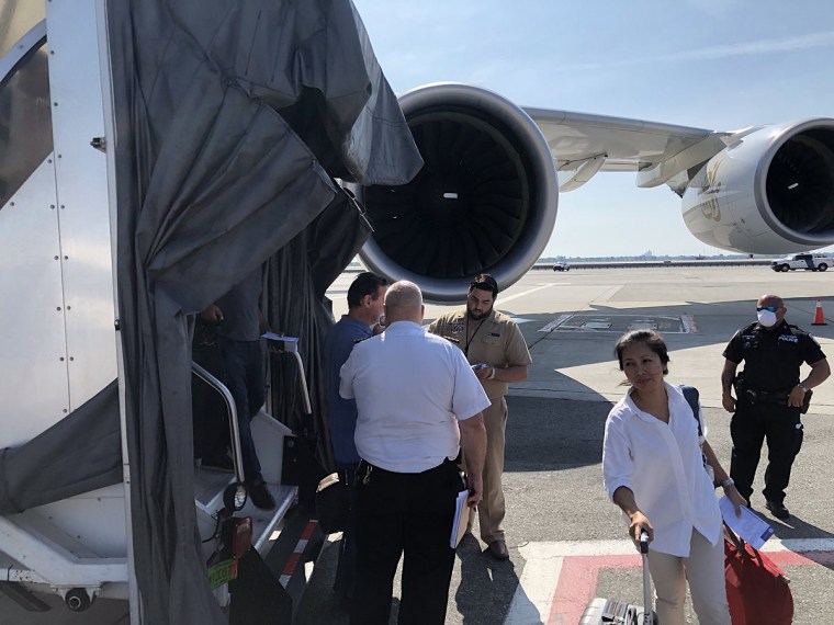 Passengers had their temperature taken as they get off an Emirates flight from Dubai at John F. Kennedy International Airport on Sept. 5, 2018 after multiple passengers complained of illness.