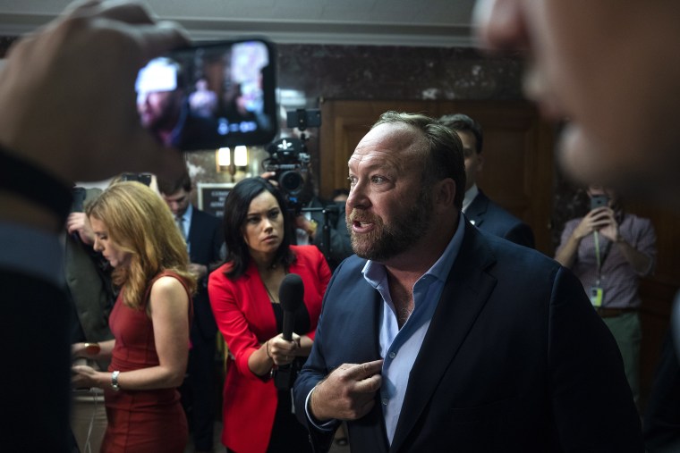 Image: Alex Jones protests Twitter and Facebook outside Senate hearing