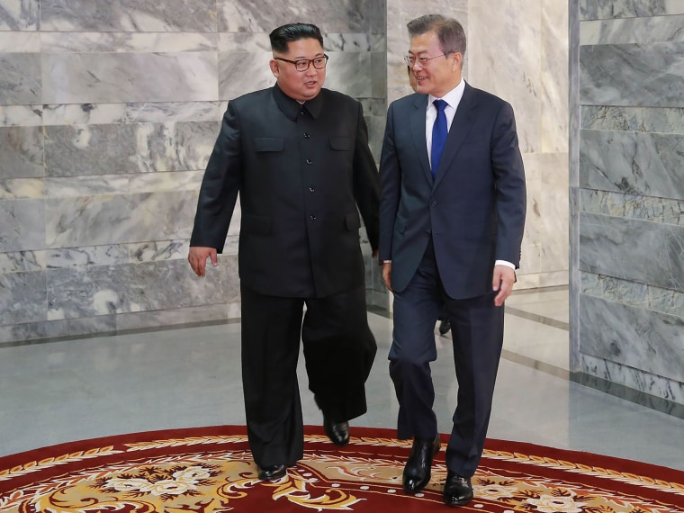 Image: South Korea's President Moon Jae-in walks with North Korean leader Kim Jong Un