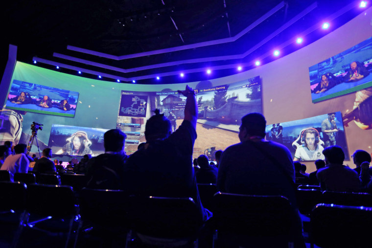 Image: Audience members watch an e-sports tournament during the Game XP 2018 at the Olympic Park in Rio de Janeiro