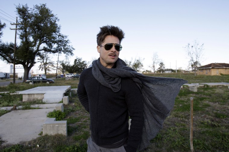 Brad Pitt walks in the area where the Make It Right Foundation is building homes in New Orleans