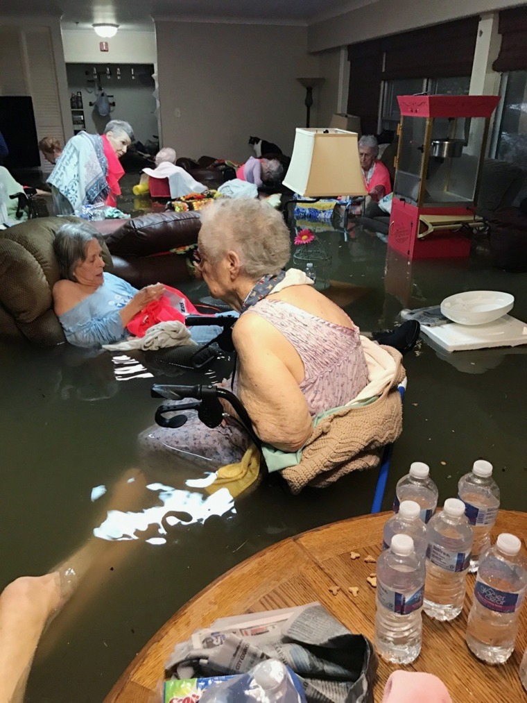 Image: Residents of the La Vita Bella nursing home in Dickinson, Texas, sit in waist-deep flood waters