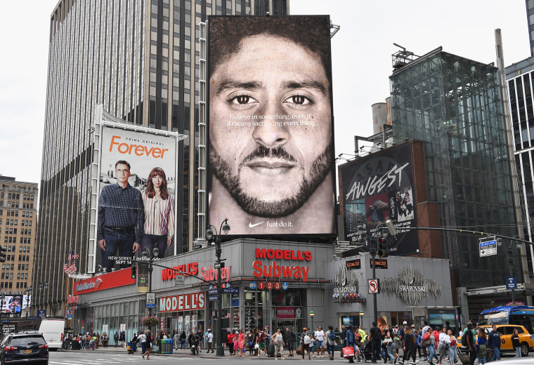 Image: A Nike ad featuring Colin Kaepernick is on display on top of a Modell's store in New York