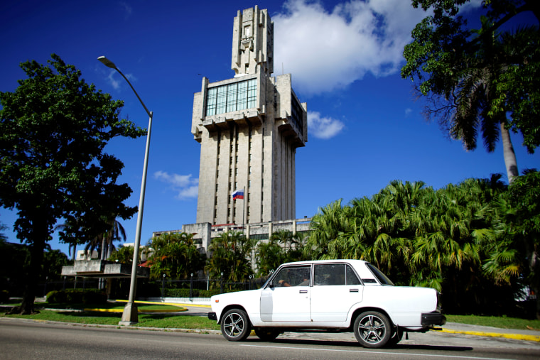 A Russian-made Lada car passes by the Russian Embassy in Havana