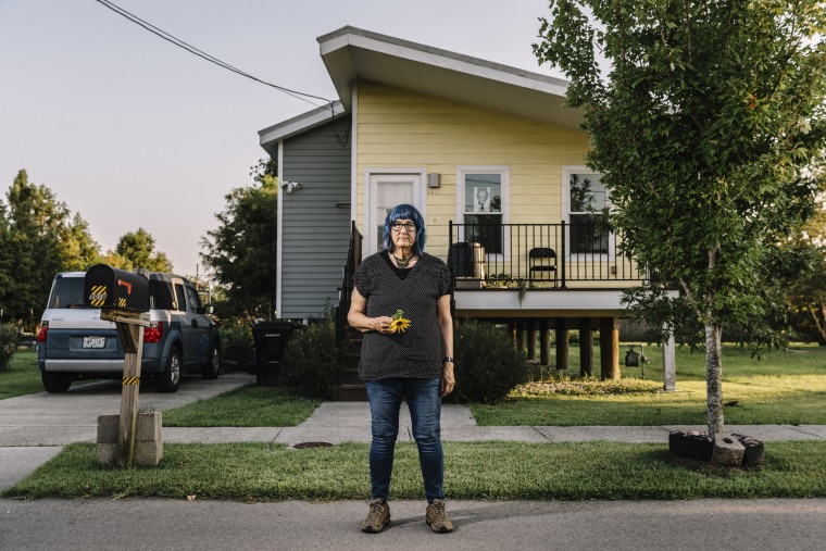 Image: Constance Fowler stands in front of the house she purchased from the Make it Right Foundation