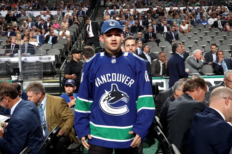 Jett Woo reacts after being selected 37th overall by the Vancouver Canucks during the 2018 NHL Draft