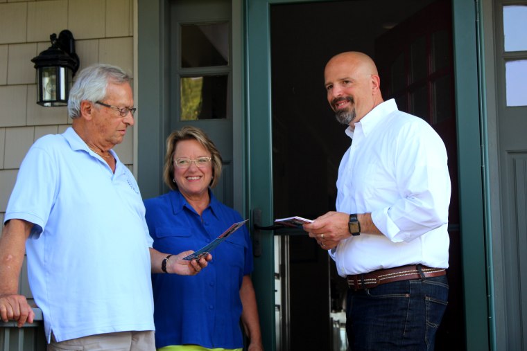 John Scott, a Republican candidate for the Connecticut General Assembly's 40th District, talks to constituents.