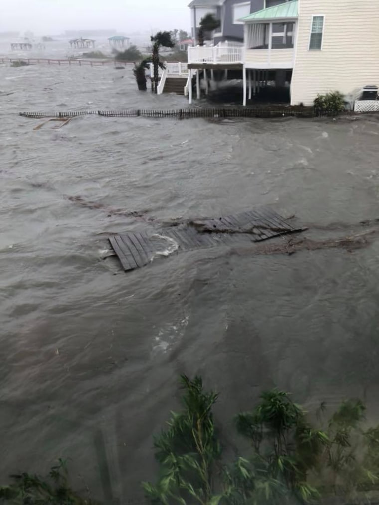 The water rises around Jeanette Rivera's house in Sneads Ferry, N.C.