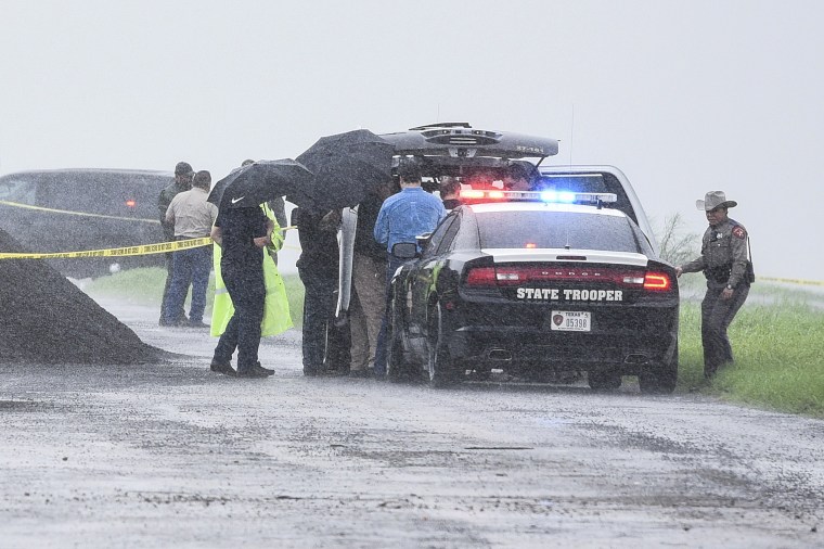 Image: Law enforcement officers gather near the scene where the body of a woman was found near Interstate 35 north of Laredo, Texas on Sept. 15, 2018.