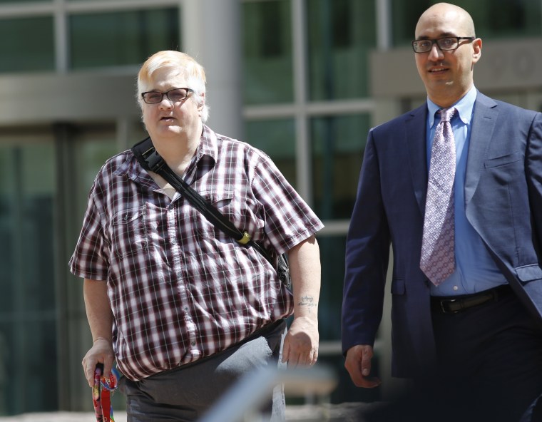 Dana Zzyym, of Fort Collins, Colorado, left, and Paul D. Castillo, staff attorney of the South Central regional office of Lambda Legal, leave after a hearing on Zzyym's lawsuit in Denver on July 20, 2016