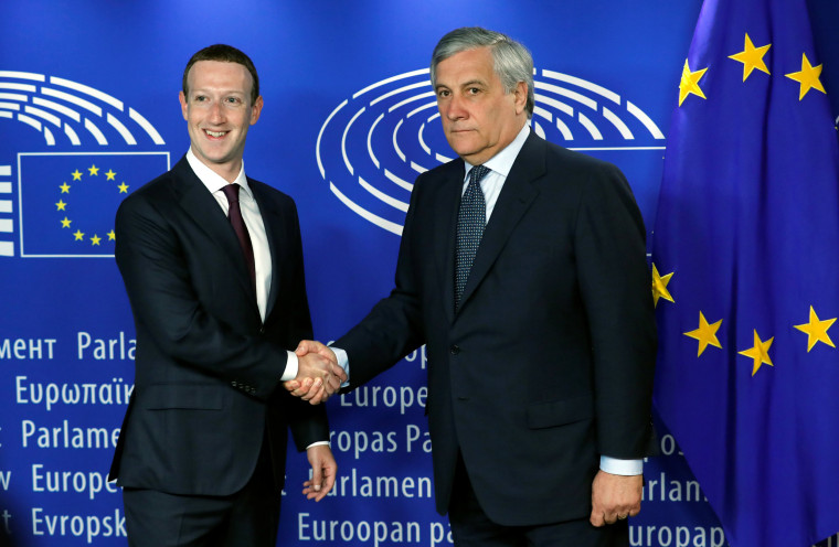 Image: Facebook's CEO Mark Zuckerberg shakes hands with European Parliament President Antonio Tajani at the European Parliament in Brussels