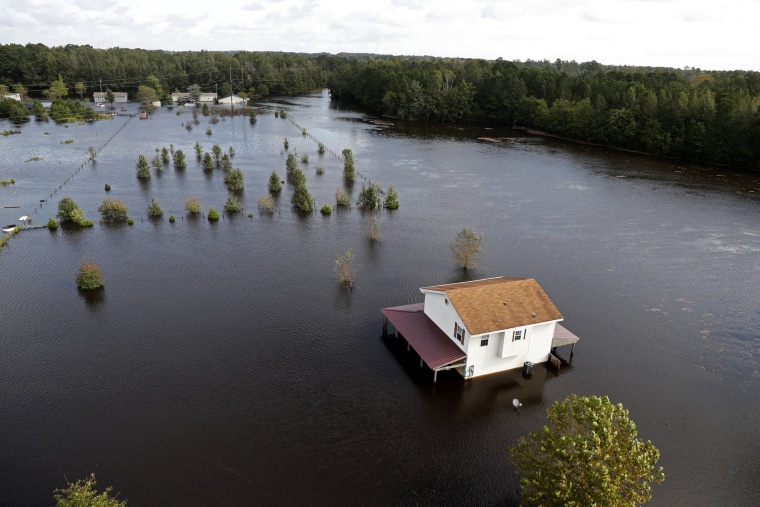 Image: A house is surrounded by floodwaters from Hurricane Florence in Lumberton