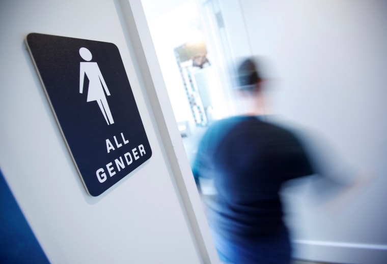 A bathroom sign welcomes both genders at the Cacao Cinnamon coffee shop in Durham North Carolina