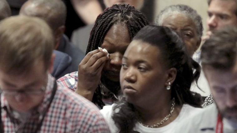 Image: Tina Hunter, center, wipes her eyes as she watches from the gallery during Chicago Police Officer Jason Van Dyke's trial