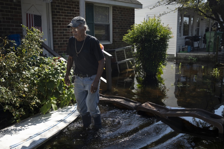 Image: James Emmanuel surveys the flooding in front of his home in Lumberton, North Carolina