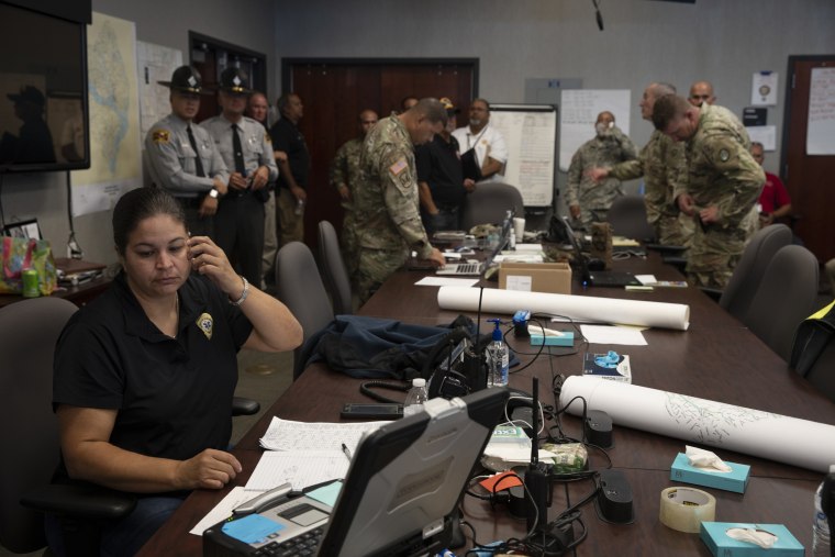 Image: Emergency personnel field phone calls related to the flooding at the Emergency Operations Center in Lumberton, North Carolina