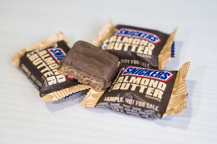 Snickers mini candy bars heap is a chocolate bar with maple almond butter  candy ang almond butter candy bar Stock Photo