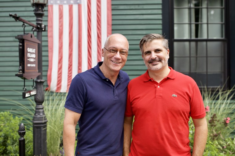 New Hampshire state Sen. Dan Innis, left, with his husband, Doug Palardy, outside the Great Island Inn, which they own, in New Castle, New Hampshire.