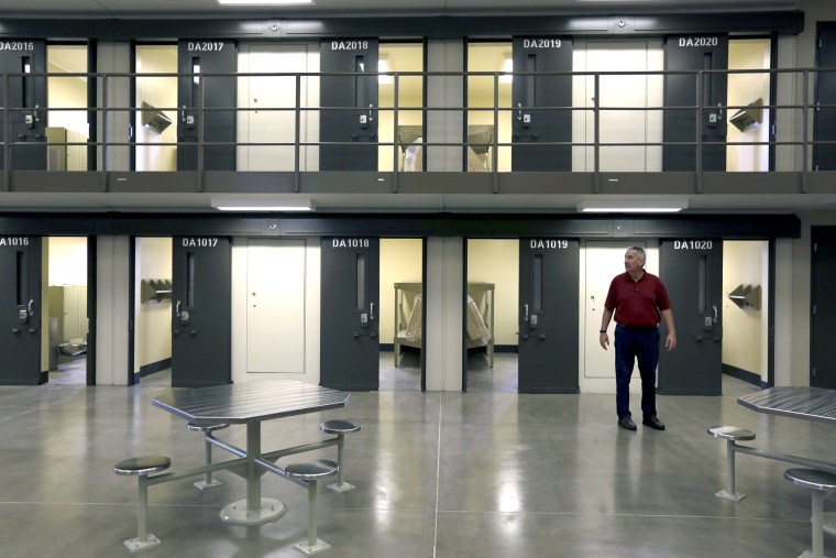 Image: A man stands in a housing unit in the West section of the State Correctional Institution at Phoenix in Collegeville, Pennsylvania on June 1, 2018.