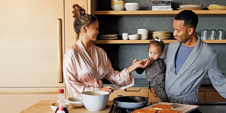 Chrissy Teigen poses with husband John Legend and their daughter, Luna.