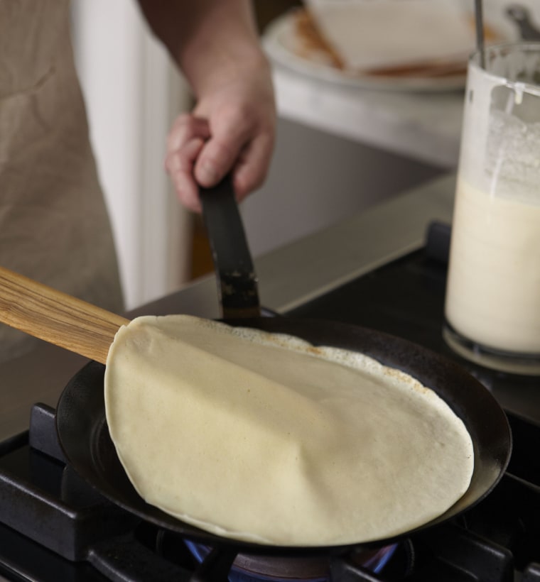 Lift and flip the crepe.