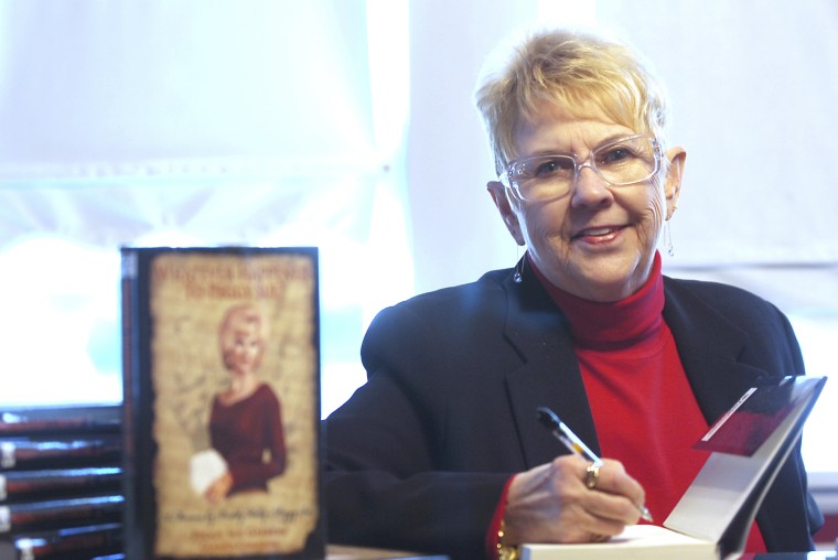 Peggy Sue Gerron unveils her new book "What Ever Happened to Peggy Sue" during a press conference in Tyler, Texas, on Jan. 11, 2008.