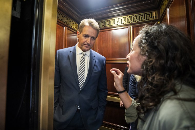 Image: Protester confronts Senator Flake in elevator
