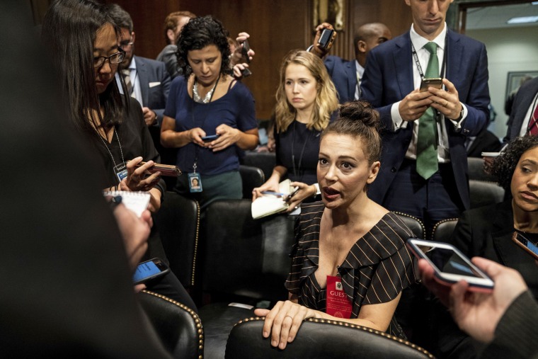 Image: Actress Alyssa Milano is seen before a Senate Judiciary Committee hearing on Sept. 27, 2018
